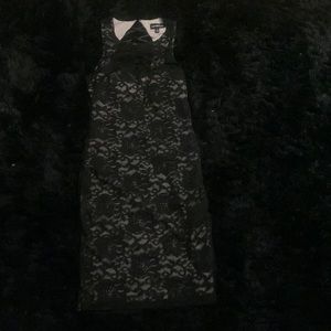 Black lace bodycon dress, with nude underlay.